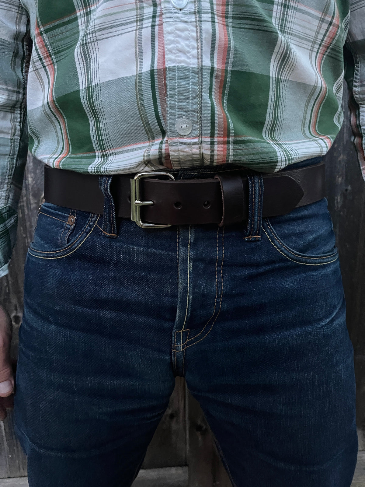 man wearing dark brown leather belt